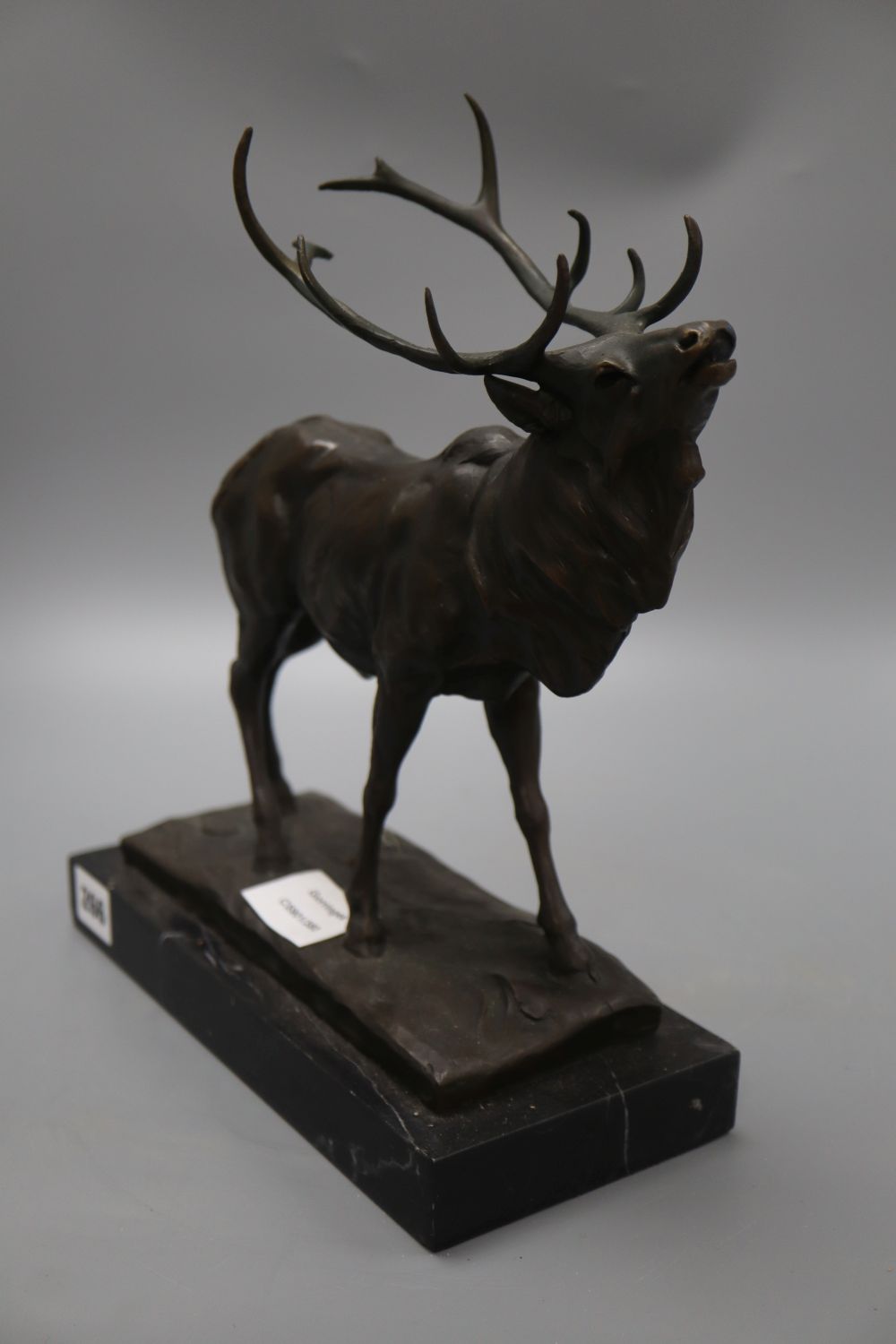 A bronze stag, signed Milo, on marble base, height 31cm